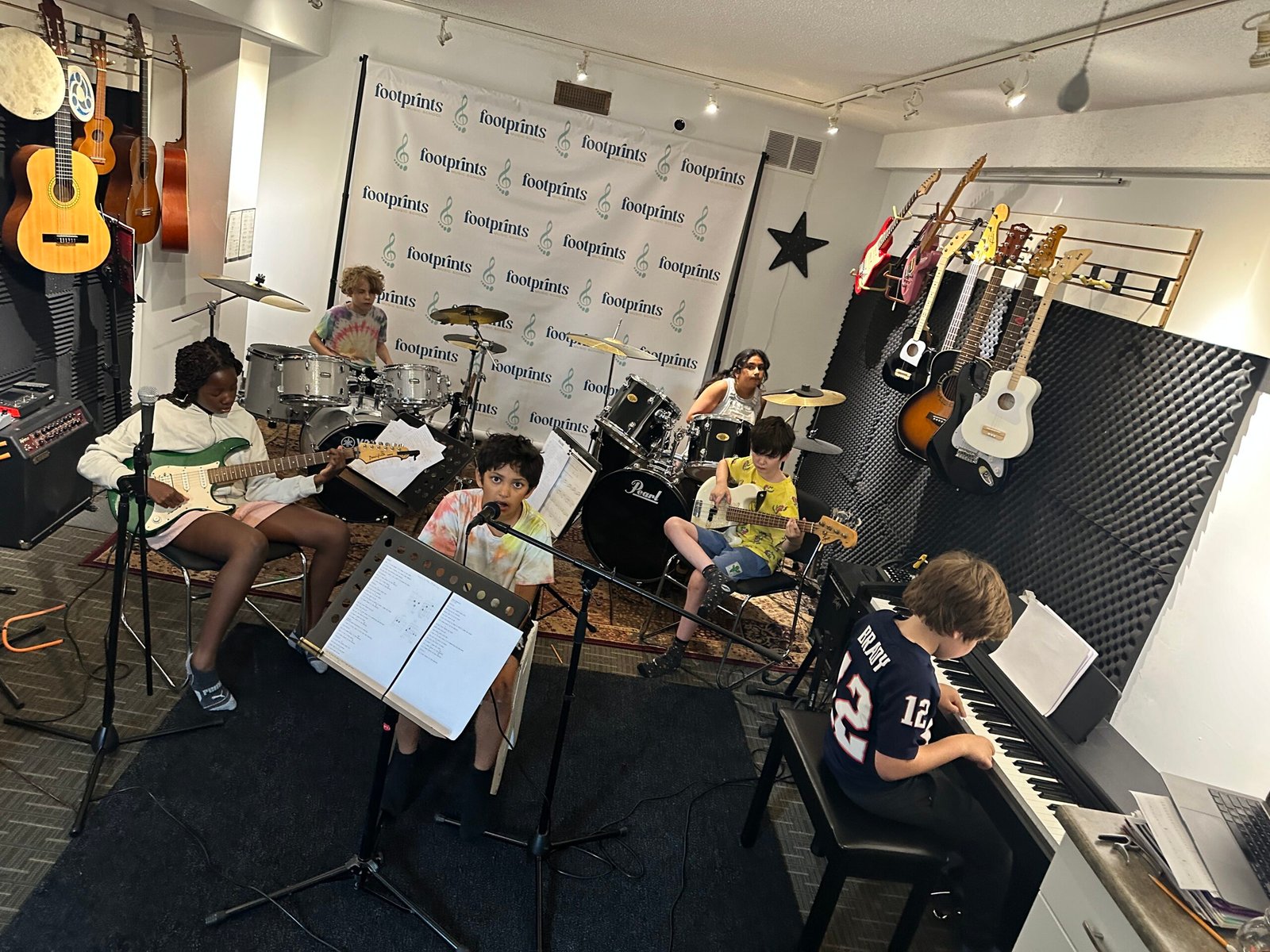 Camper confidently performing during Summer Rock Camp